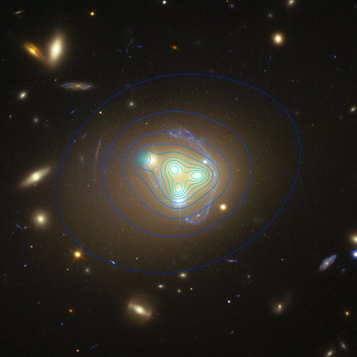 Cụm đám thiên hà Abell 3827 với các vòng xanh được cho là nơi hiện diện vật chất tối.
